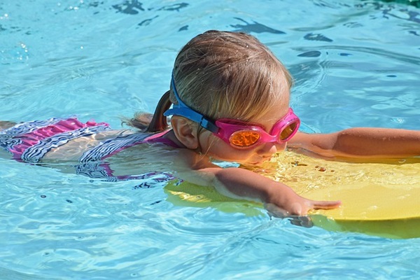 Girl playing in the pool